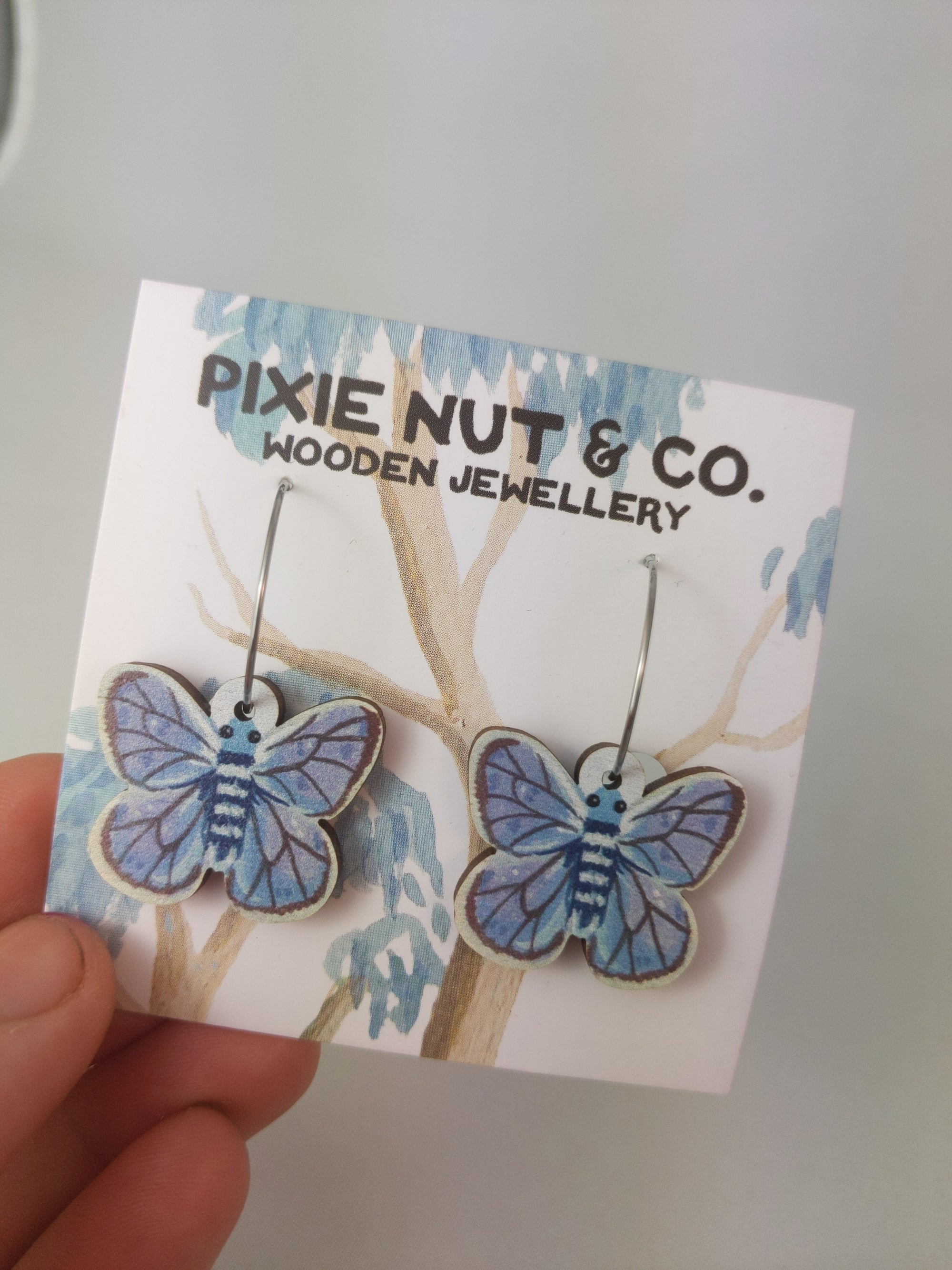 earrings of grey blue moths on wire dangles